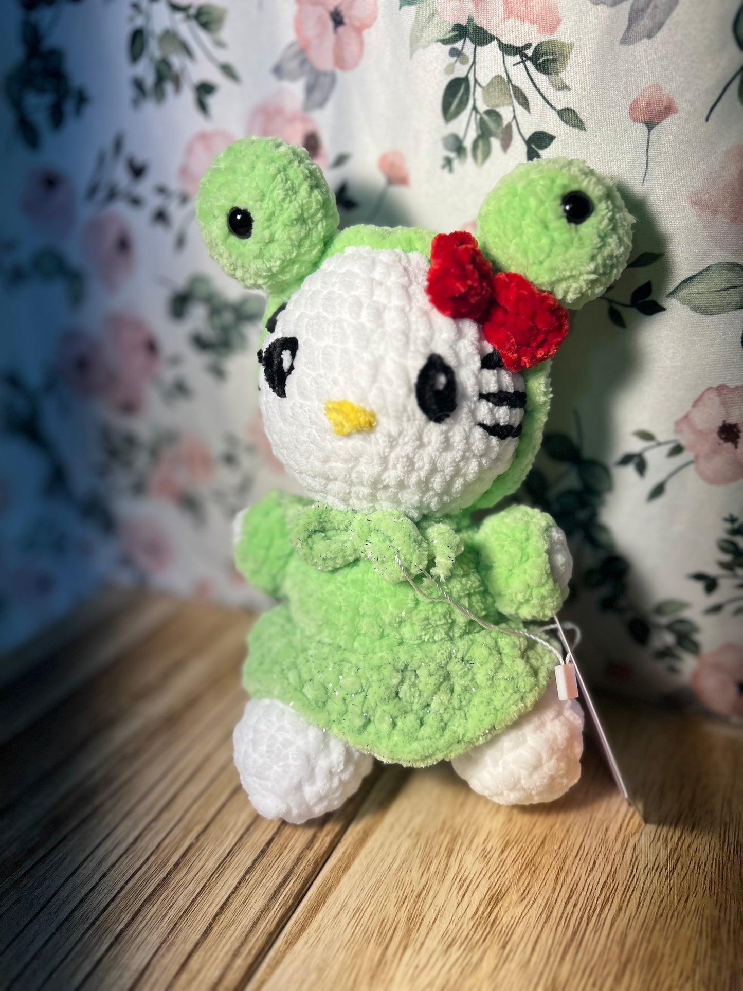 Crochet hello kitty in a frog outfit