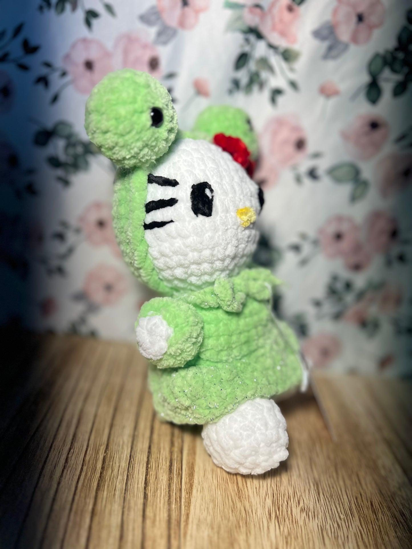Crochet hello kitty in a frog outfit